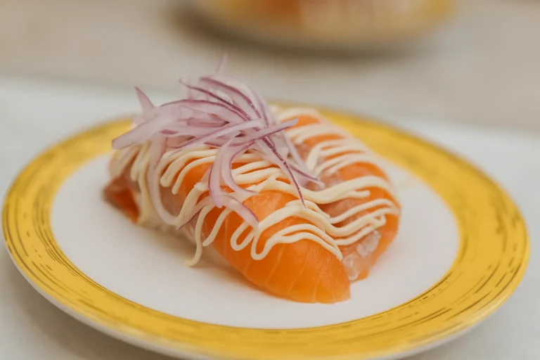 An Onion Salmon Nigiri in plate of sushiro singapore
